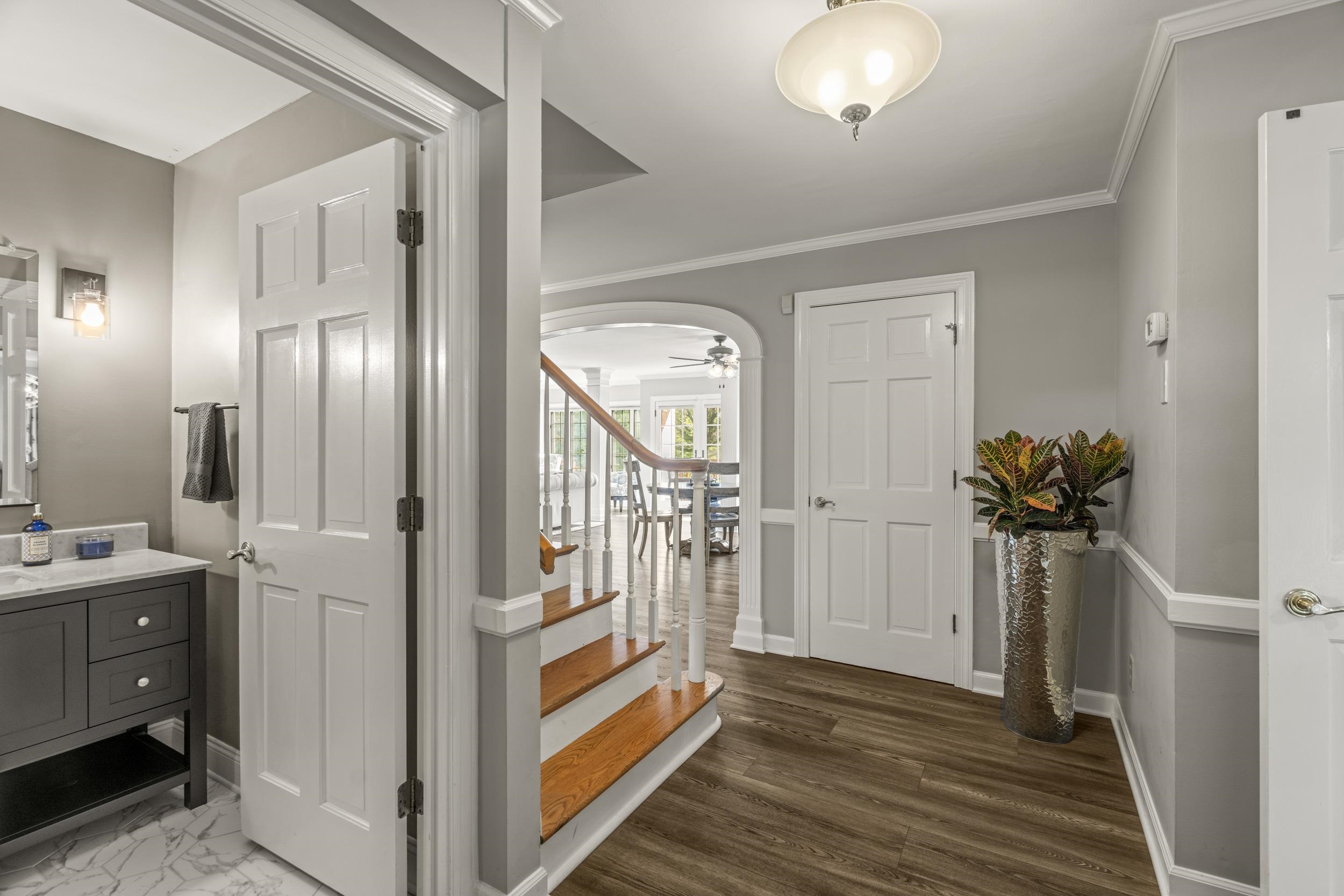 1109 Ross Road Lexington, VA 24450 - Photo 4 of 71 a view of a hallway with wooden floor and staircase