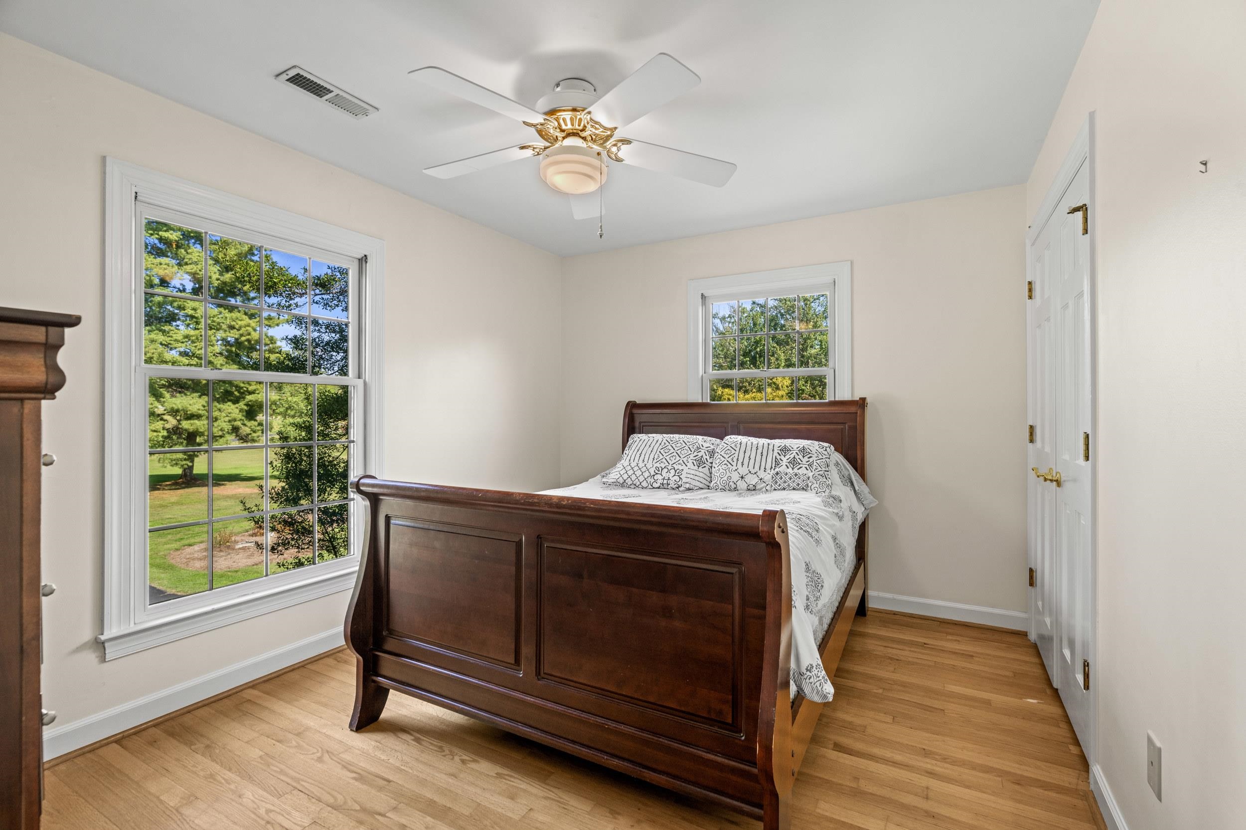 1109 Ross Road Lexington, VA 24450 - Photo 41 of 71 a bed sitting in a bedroom next to a window