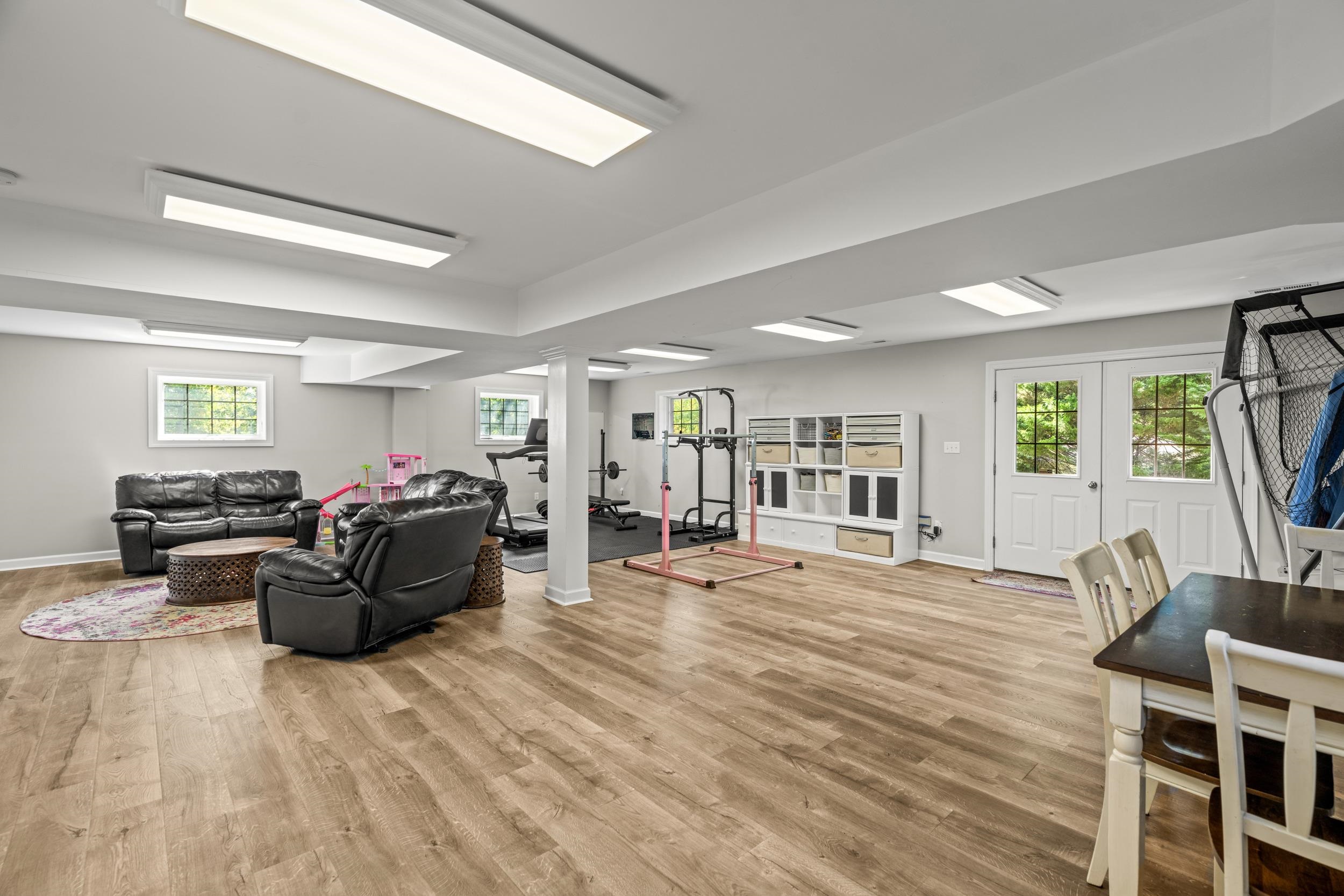 1109 Ross Road Lexington, VA 24450 - Photo 45 of 71 a living room with furniture and a flat screen tv
