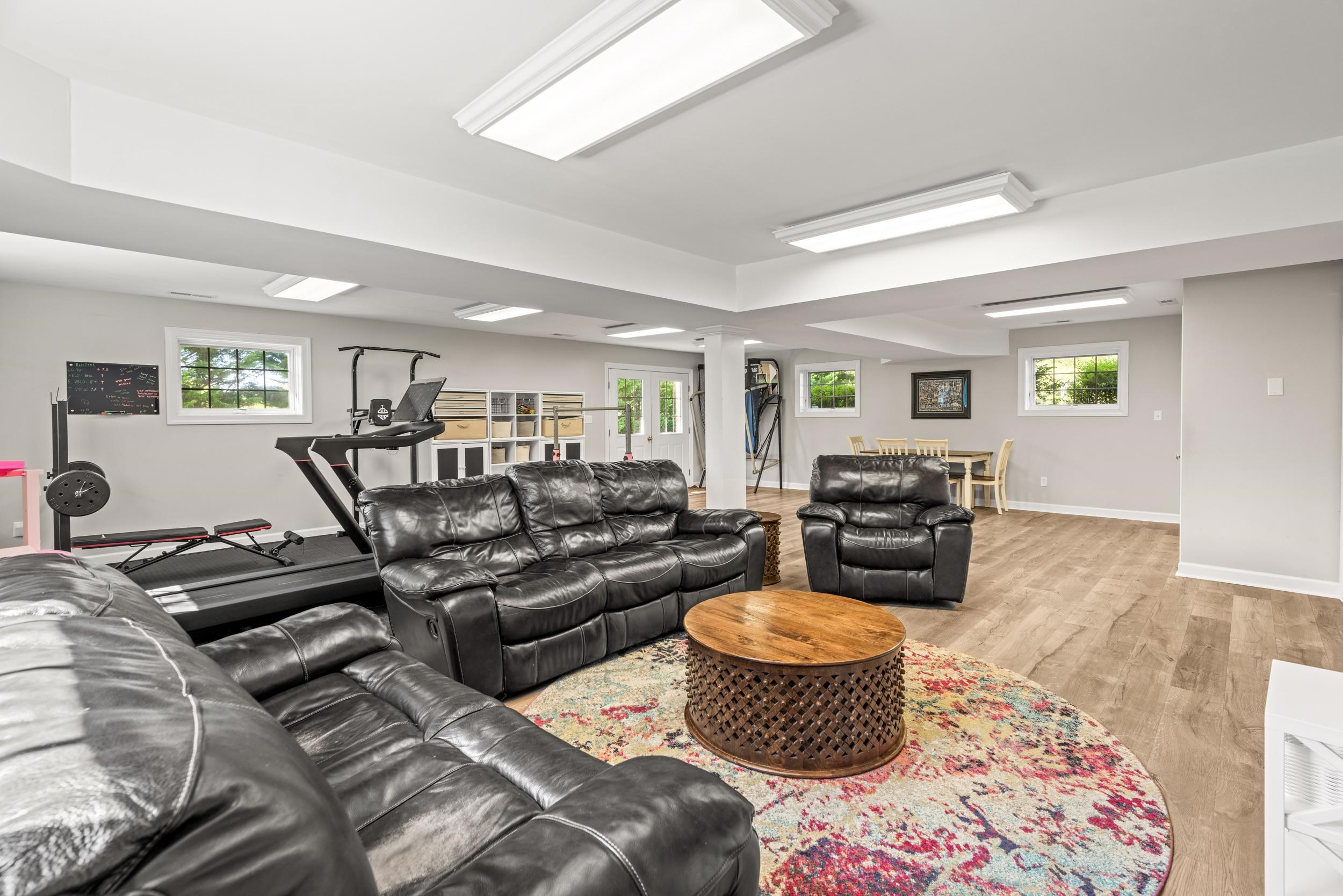 1109 Ross Road Lexington, VA 24450 - Photo 46 of 71 a living room with furniture and a wooden floor