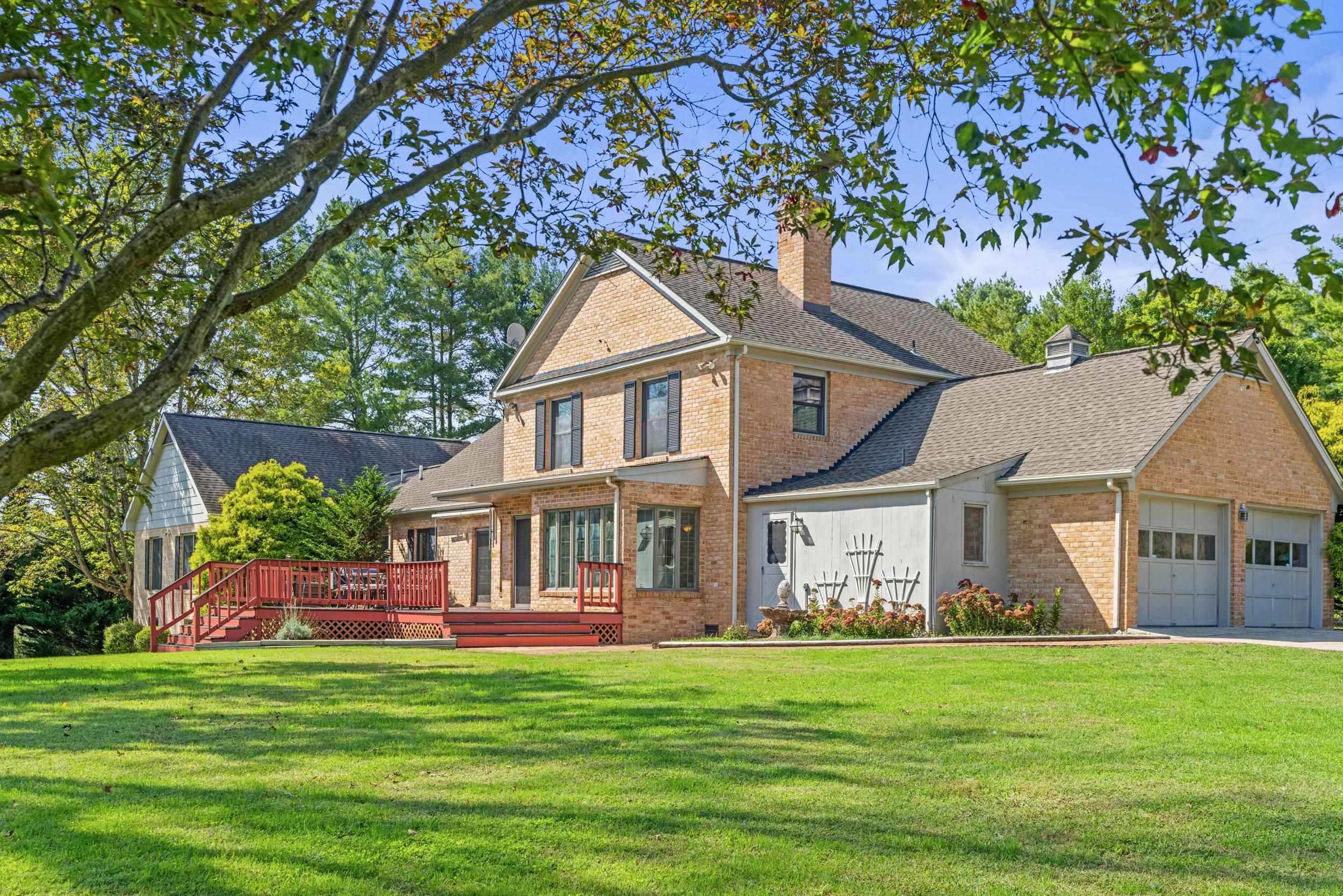 1109 Ross Road Lexington, VA 24450 - Photo 52 of 71 a front view of a house with a garden
