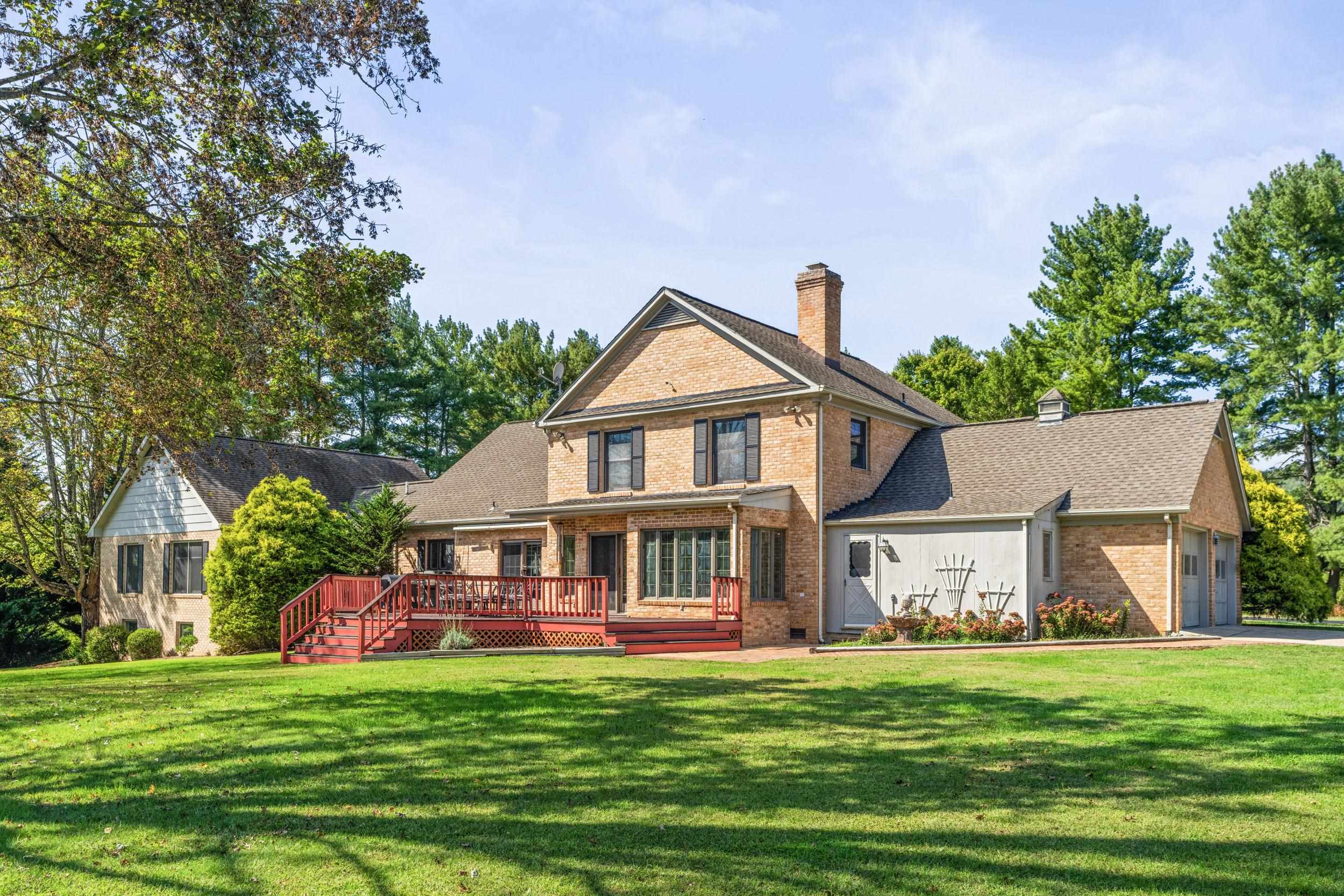 1109 Ross Road Lexington, VA 24450 - Photo 53 of 71 a front view of a house with a garden and porch