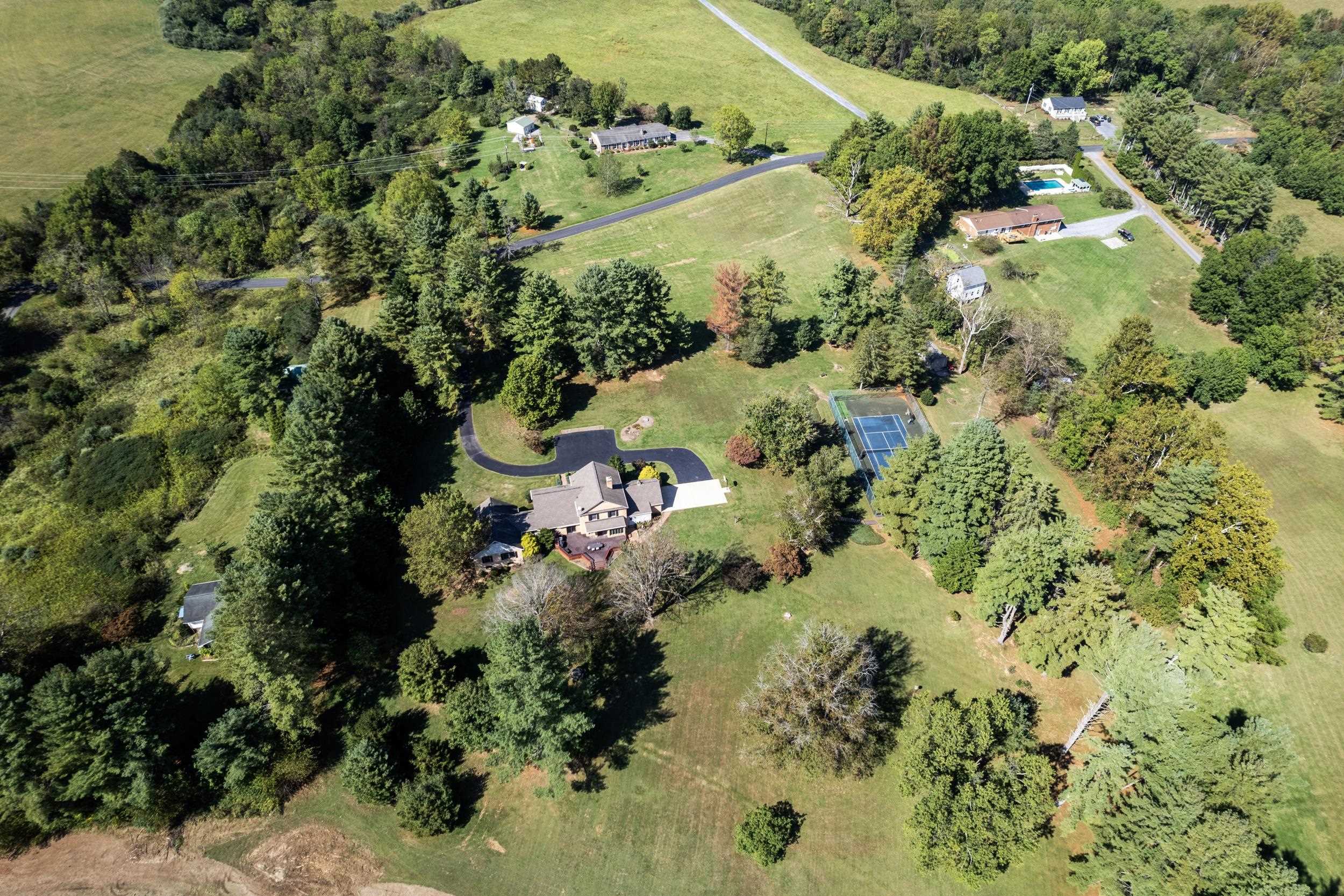 1109 Ross Road Lexington, VA 24450 - Photo 68 of 71 an aerial view of residential houses with outdoor space and trees all around
