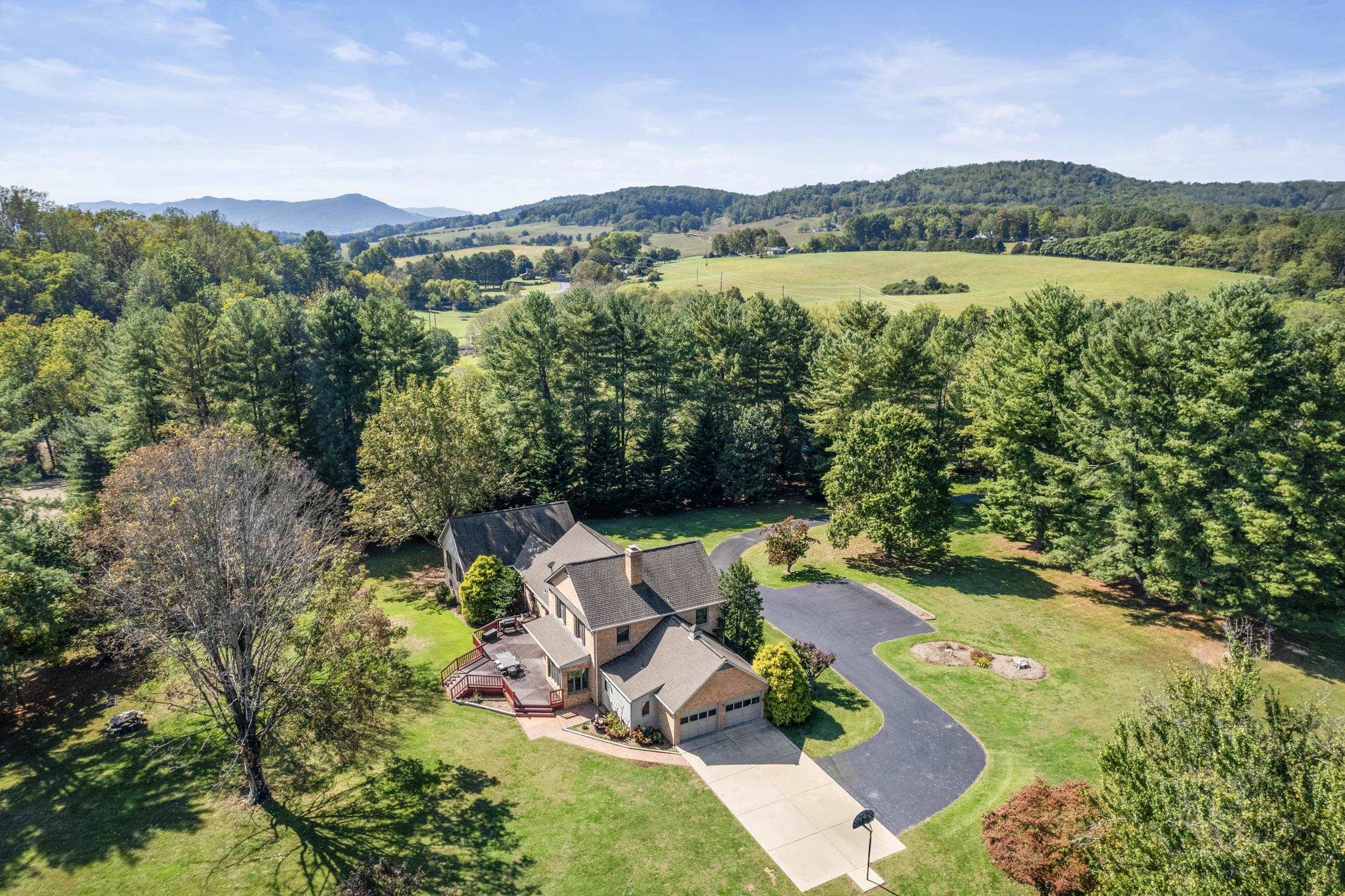 1109 Ross Road Lexington, VA 24450 - Photo 70 of 71 an aerial view of a house with garden space and outdoor space
