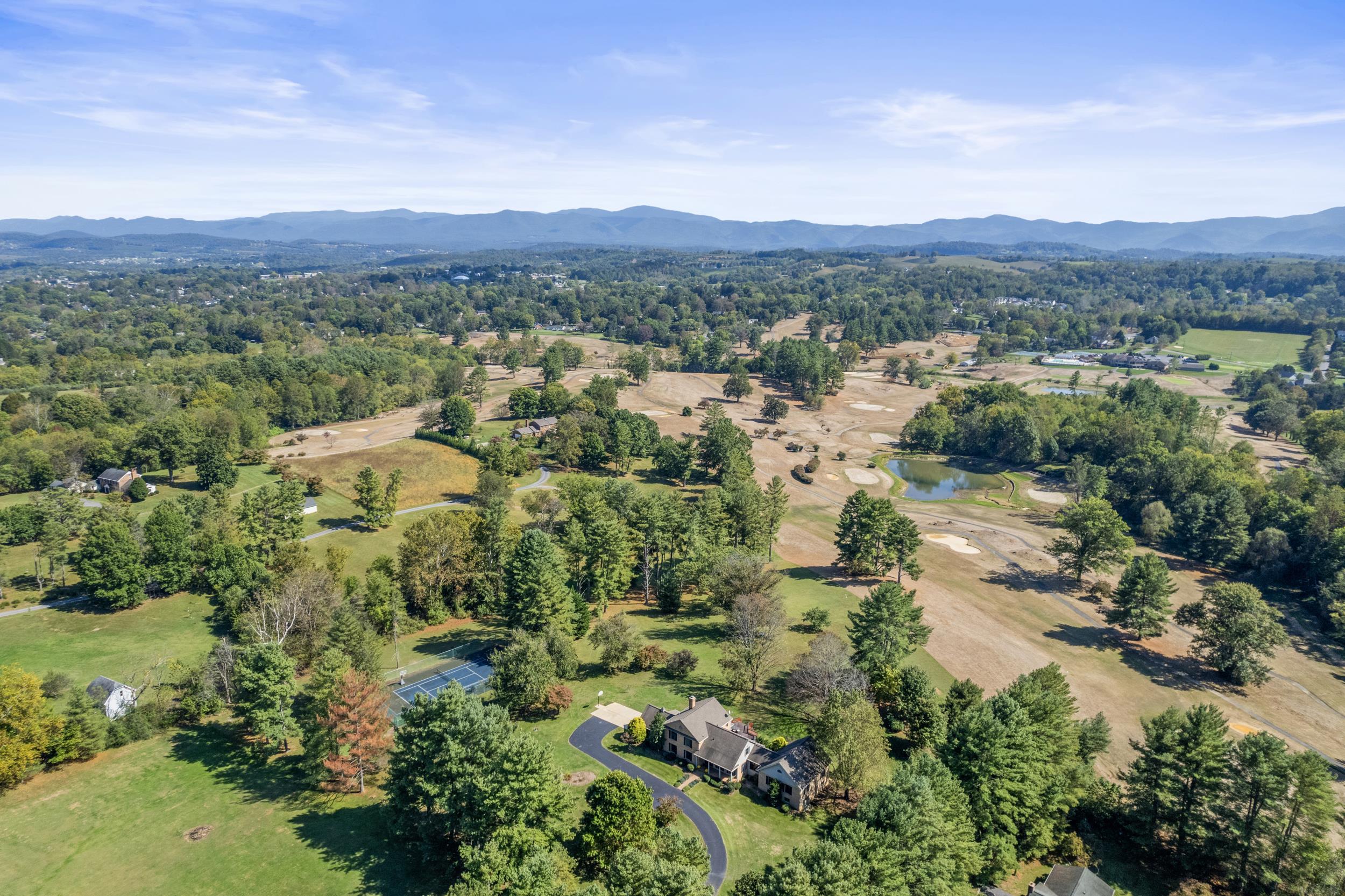 1109 Ross Road Lexington, VA 24450 - Photo 71 of 71 an aerial view of green landscape with trees houses and mountain view