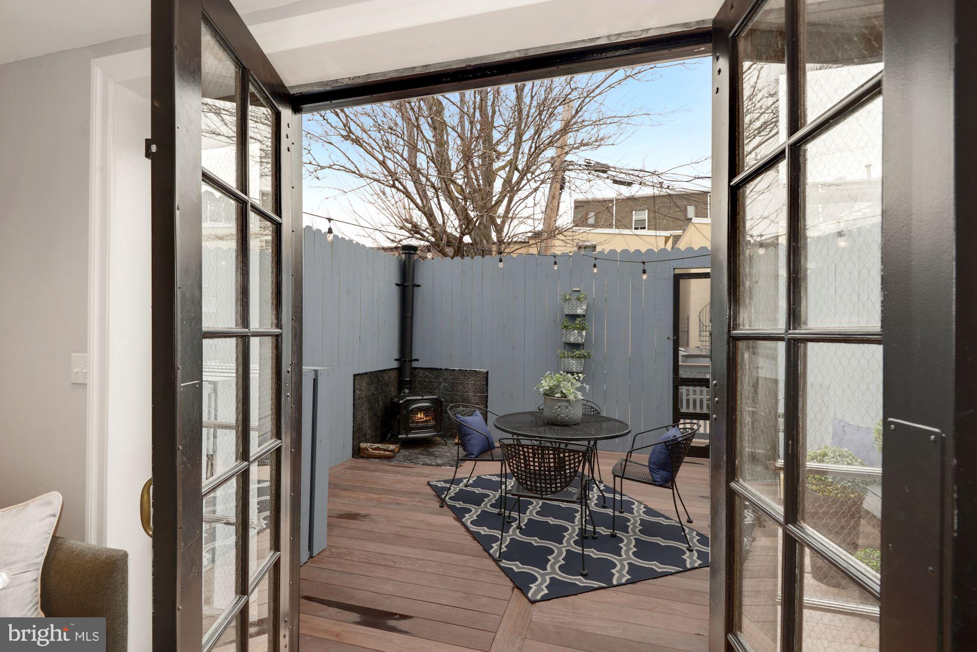 1325 Riggs Street Northwest Washington, DC 20009 - Photo 21 of 51 Vintage schoolhouse doors to idyllic deck
