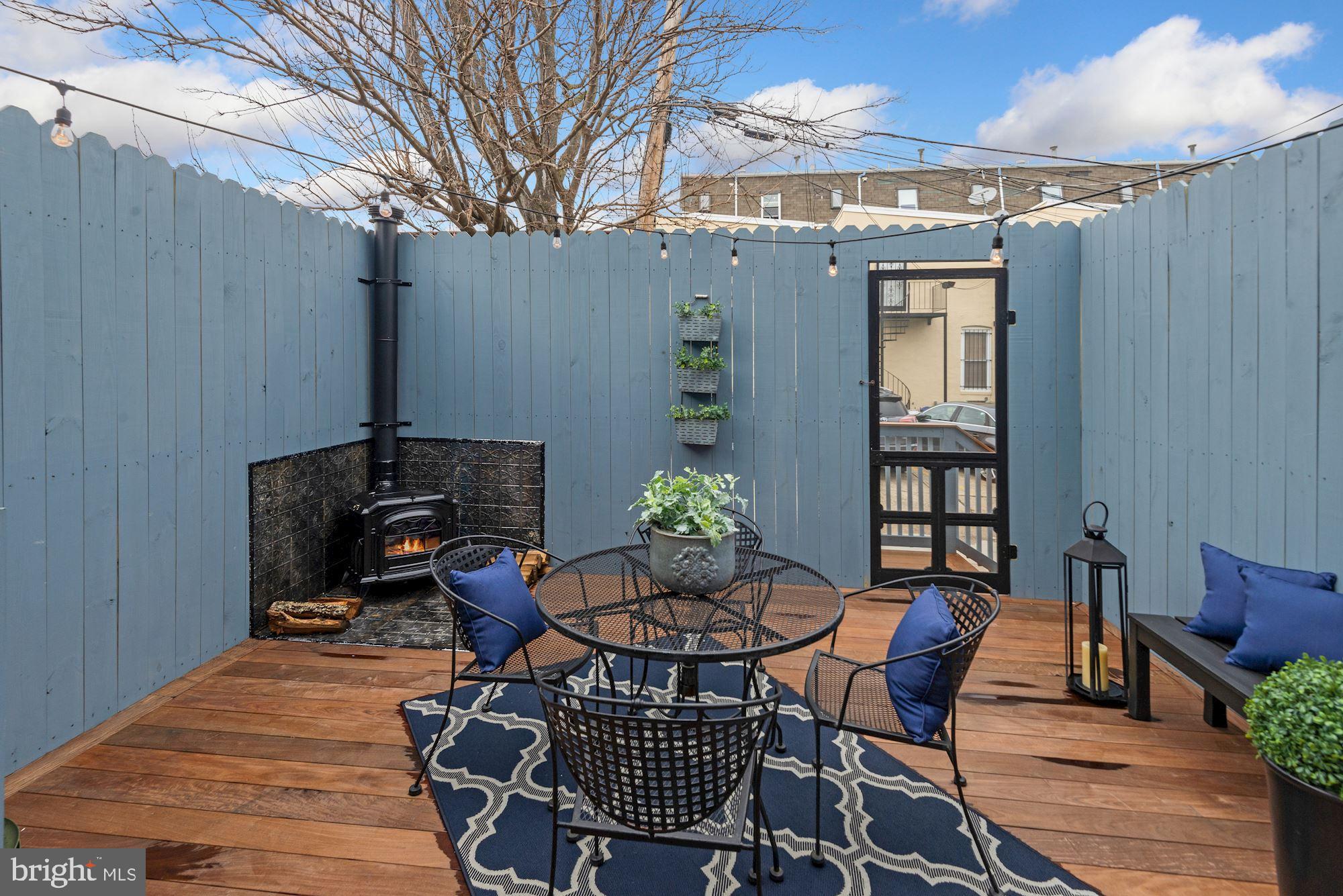 1325 Riggs Street Northwest Washington, DC 20009 - Photo 22 of 51 Ipa wood deck with wood burning stove