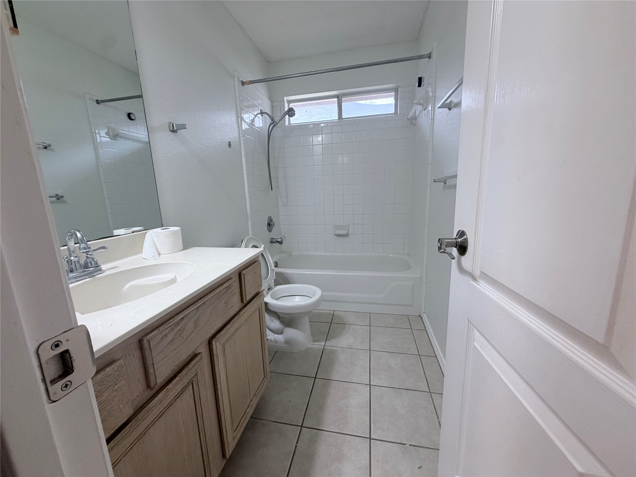 20809 Pacers Gait Lane Pflugerville, TX 78660 - Photo 4 of 23 Full bathroom featuring vanity, shower / bath combination, and light tile patterned floors