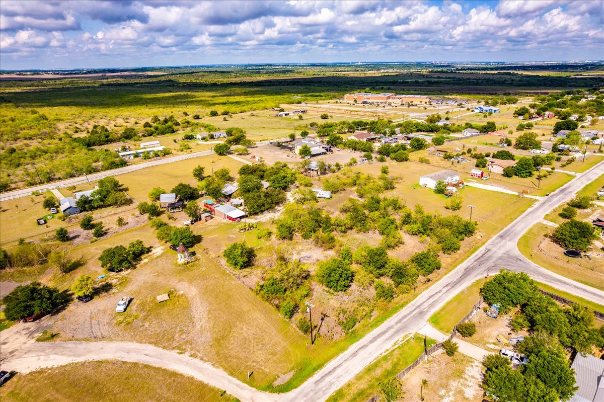 2411 Rohde Road Kyle, TX 78640 - Photo 39 of 40 Expansive rural acreage offers natural vegetation and convenient road frontage under a wide open sky.