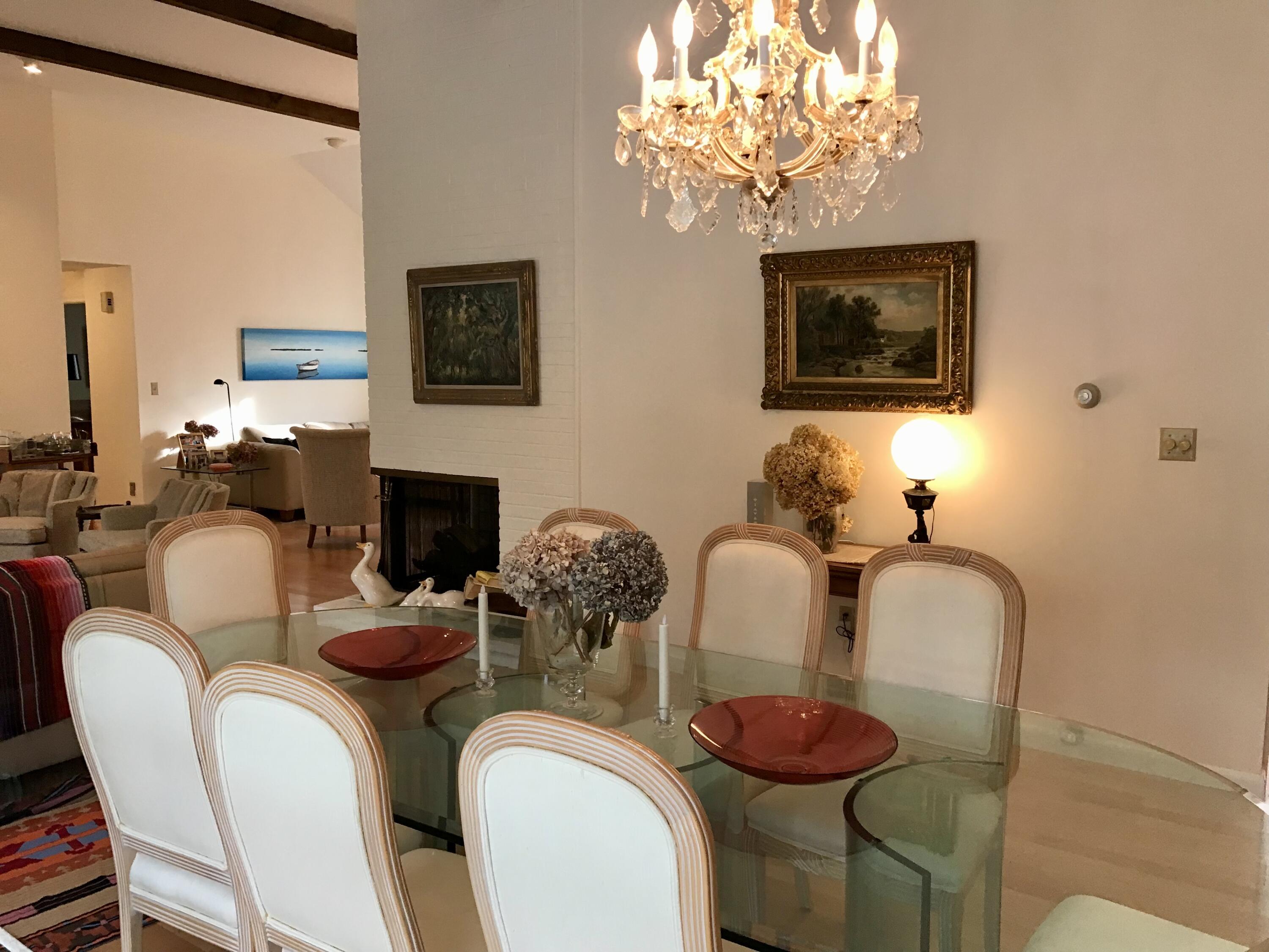 17 The Morgan Circle Mashpee, MA 02649 - Photo 12 of 49 a dining room with furniture and a fireplace