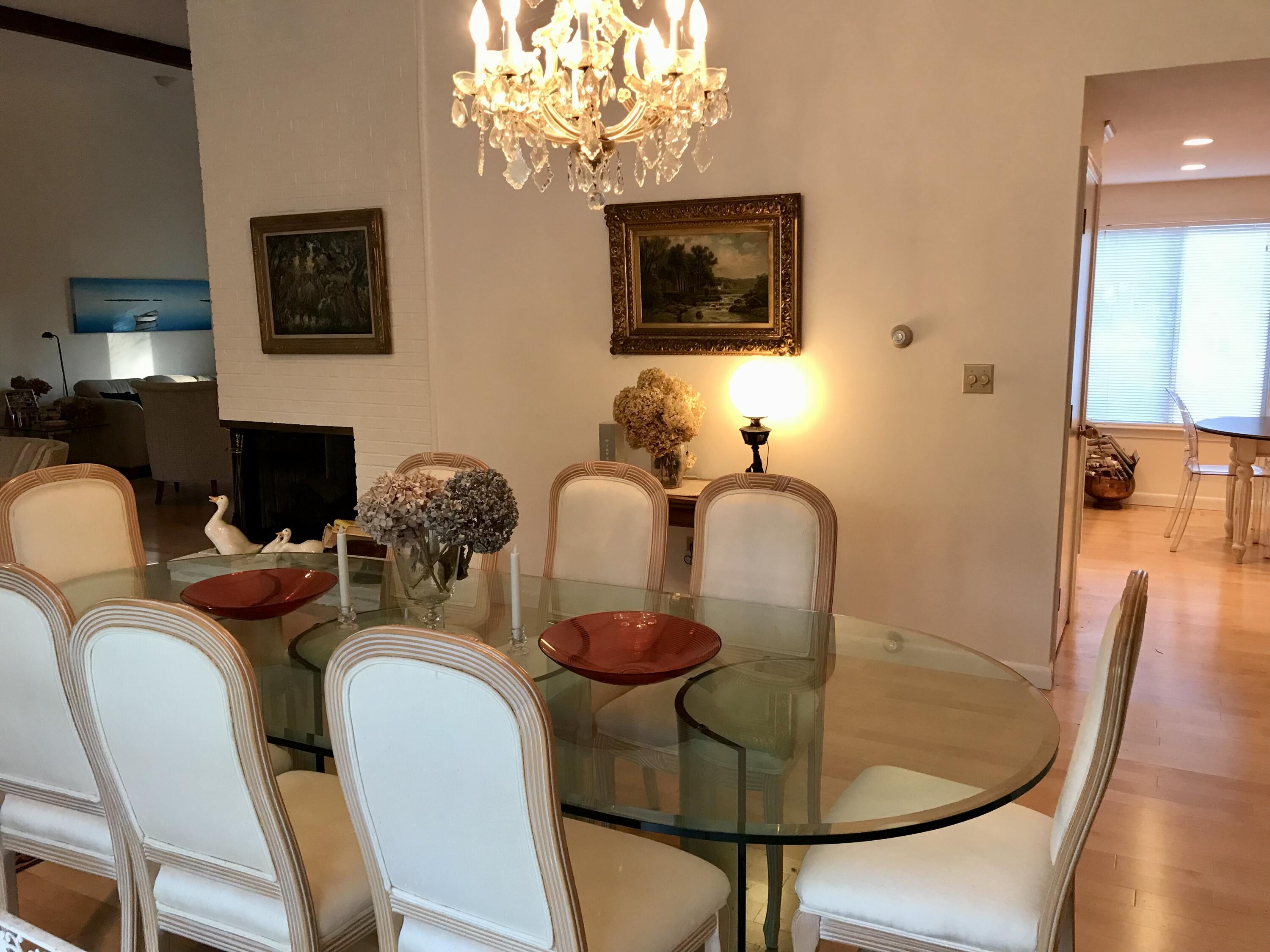 17 The Morgan Circle Mashpee, MA 02649 - Photo 14 of 49 a dining room with furniture a chandelier and wooden floor