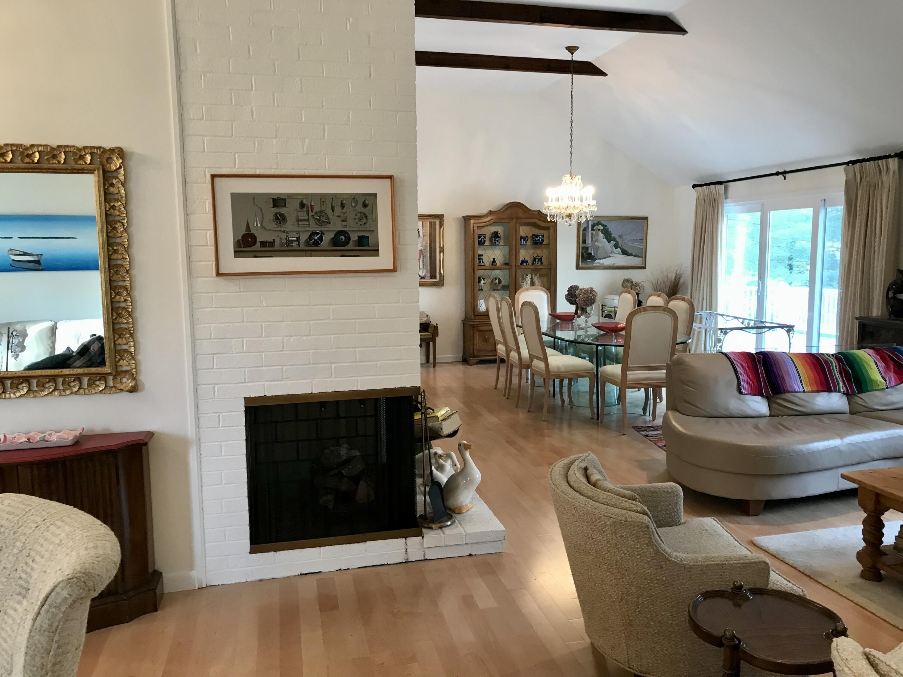 17 The Morgan Circle Mashpee, MA 02649 - Photo 16 of 49 a living room with furniture a fireplace and a large mirror