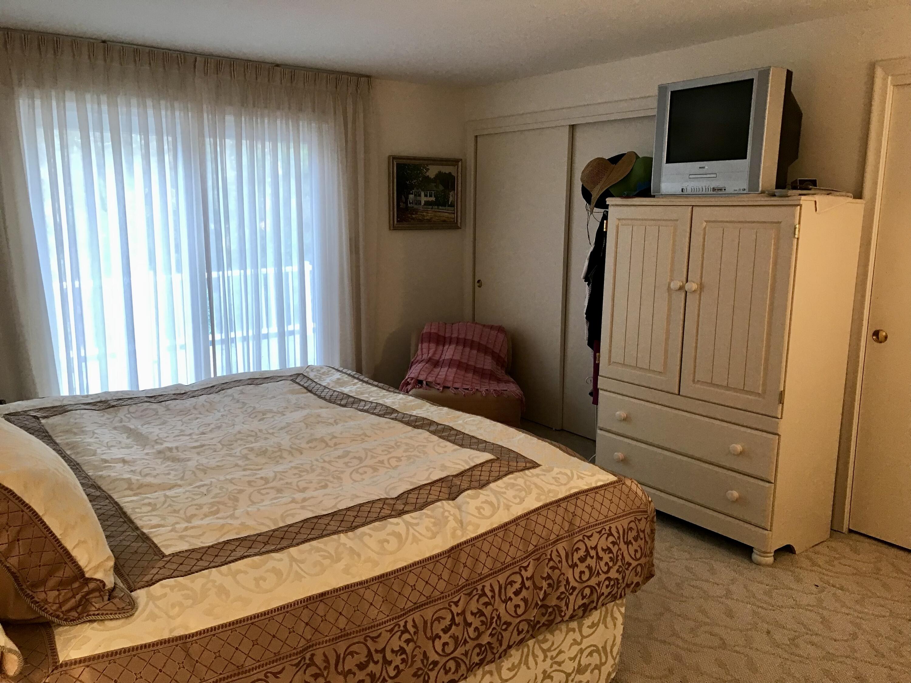 17 The Morgan Circle Mashpee, MA 02649 - Photo 35 of 49 a bedroom with a bed and flat screen tv
