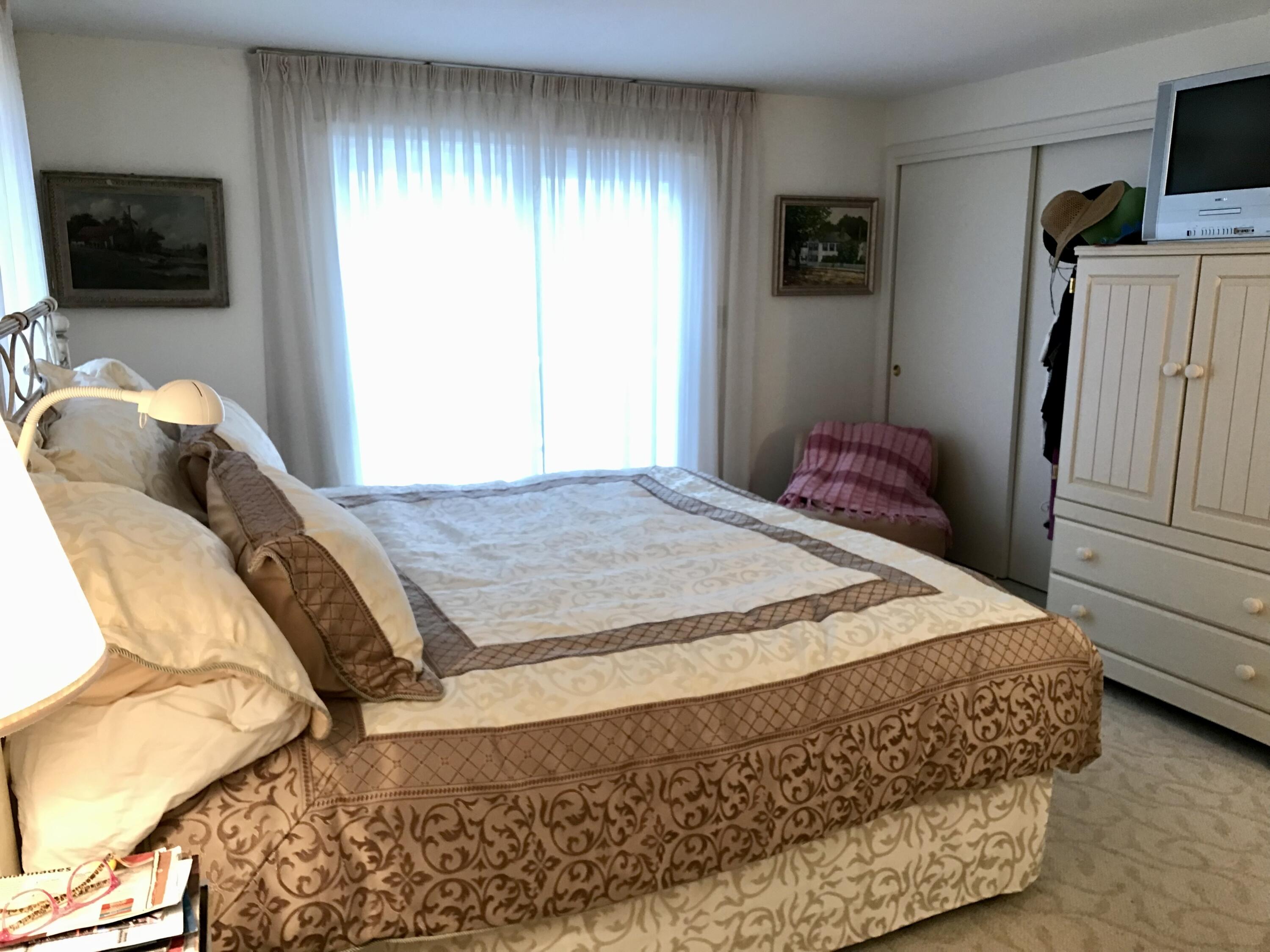 17 The Morgan Circle Mashpee, MA 02649 - Photo 36 of 49 a bedroom with a bed and flat screen tv