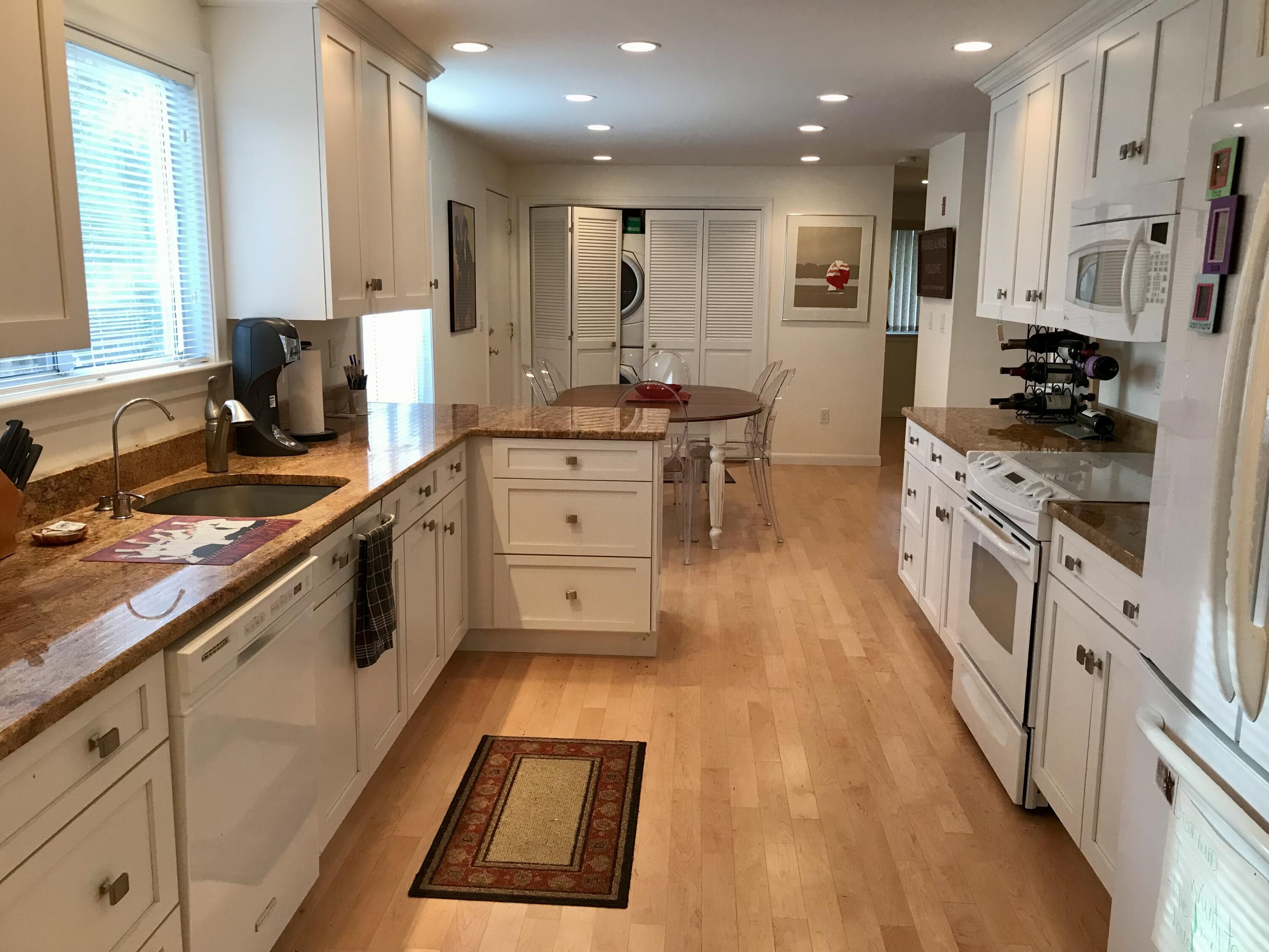 17 The Morgan Circle Mashpee, MA 02649 - Photo 5 of 49 a kitchen with stainless steel appliances kitchen island granite countertop a stove a sink and a refrigerator
