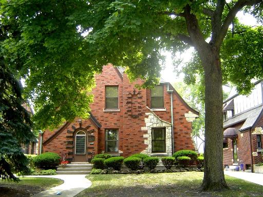 70 North Herbert Road Riverside, IL 60546 - Photo 1 of 1 a front view of a house with a yard and potted plants