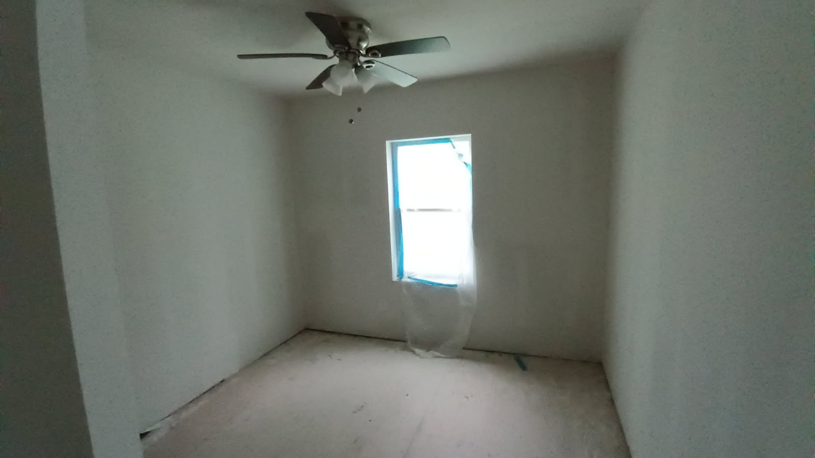 112 Ila Street Elgin, TX 78621 - Photo 14 of 27 an empty room with a window and a fan