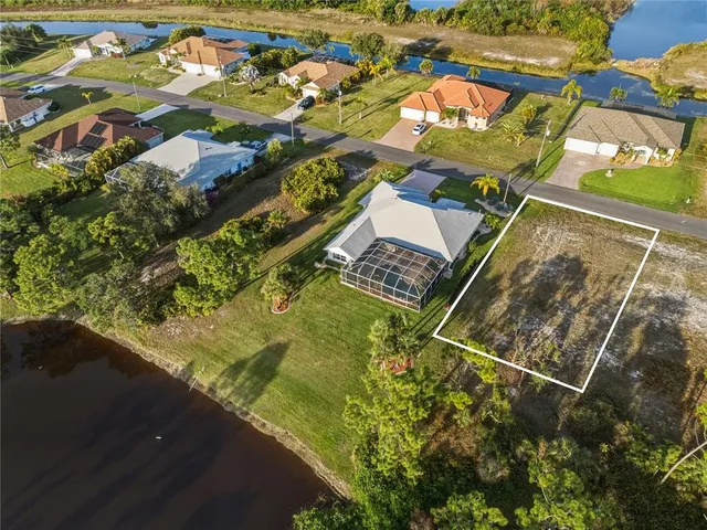 an aerial view of house with yard swimming pool and outdoor seating