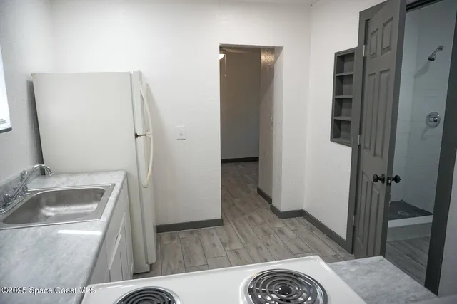 a bathroom with a sink and a large mirror