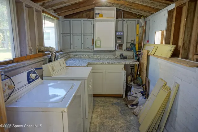 a bathroom with a sink mirror and a bathtub