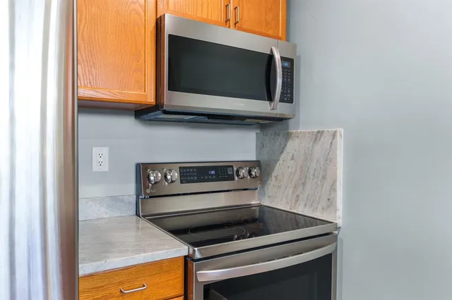 a kitchen with a stove and a microwave