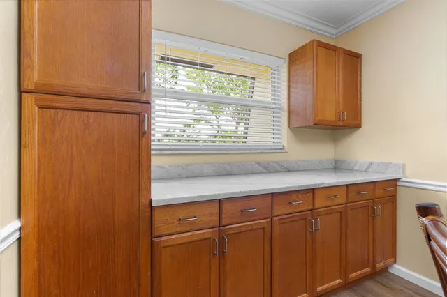 a kitchen with granite countertop a sink and a window