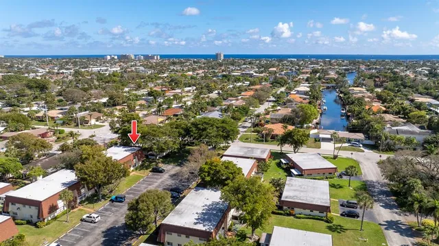 an aerial view of residential building with parking space