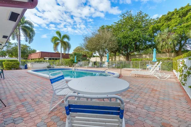 a bedroom with a bed and a ceiling fan