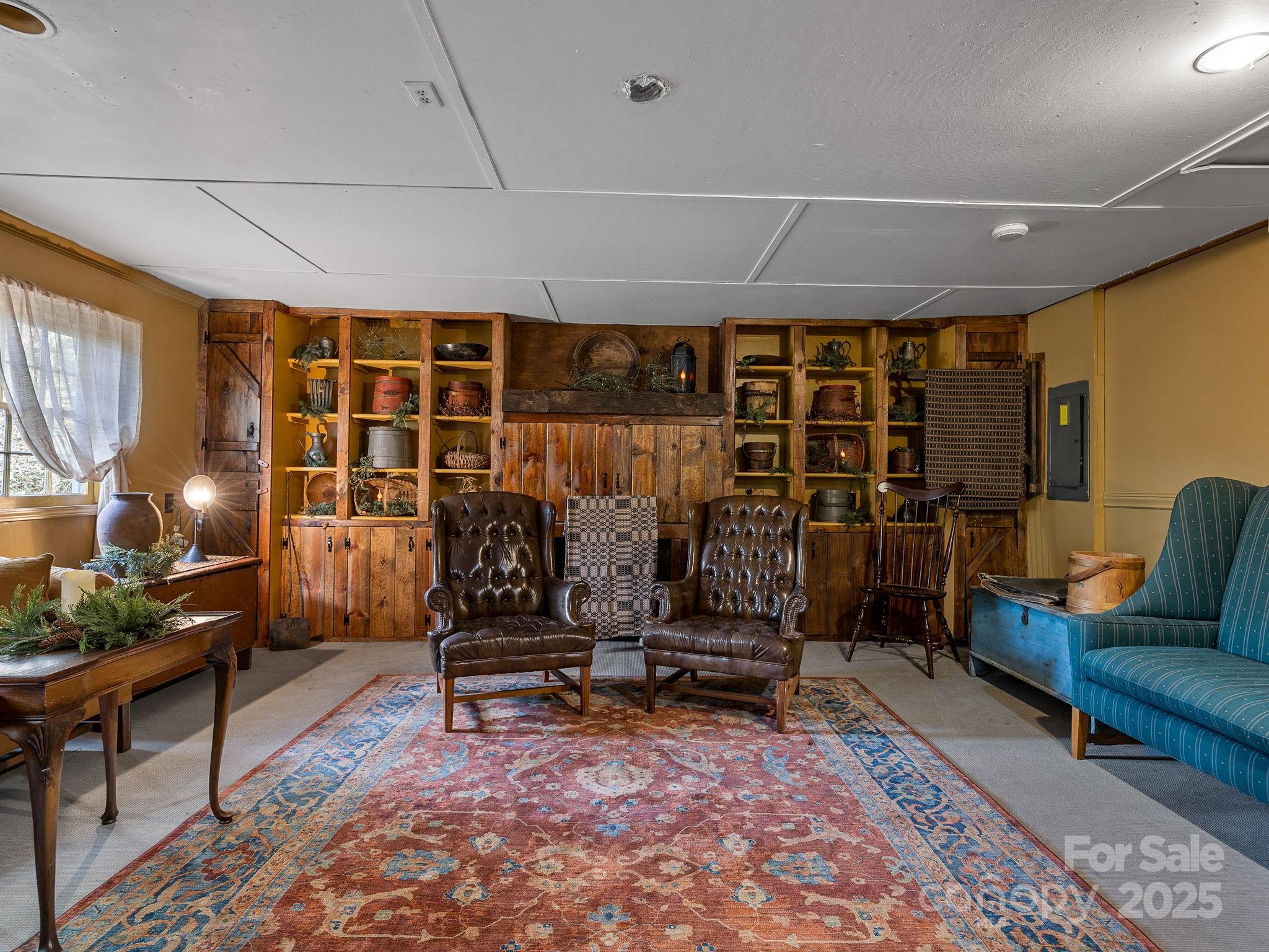 1933 John Shehan Road Mill Spring, NC 28756 - Photo 14 of 25 a living room with furniture a rug and white walls