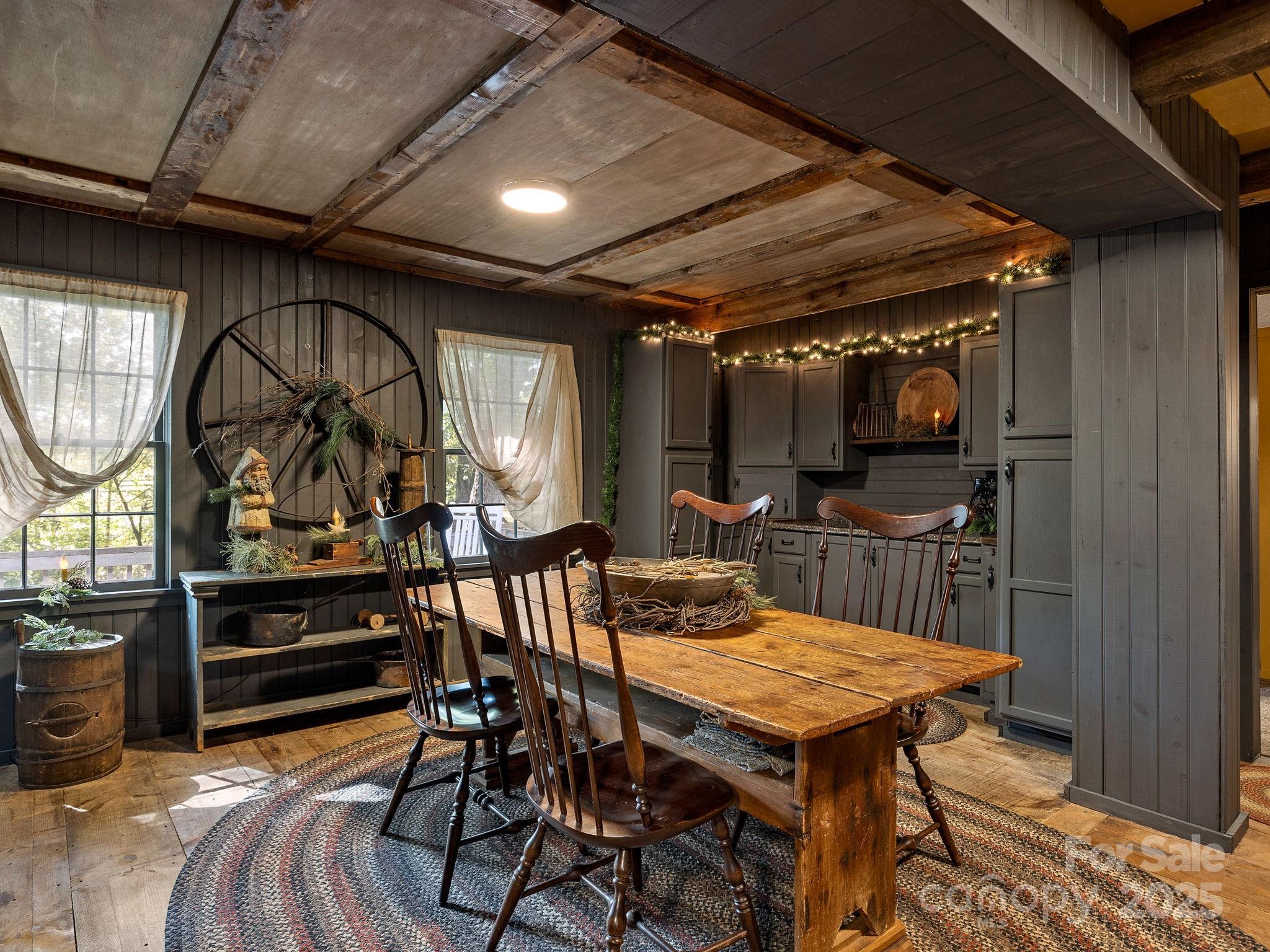 1933 John Shehan Road Mill Spring, NC 28756 - Photo 3 of 25 a view of a dining room with furniture window and wooden floor
