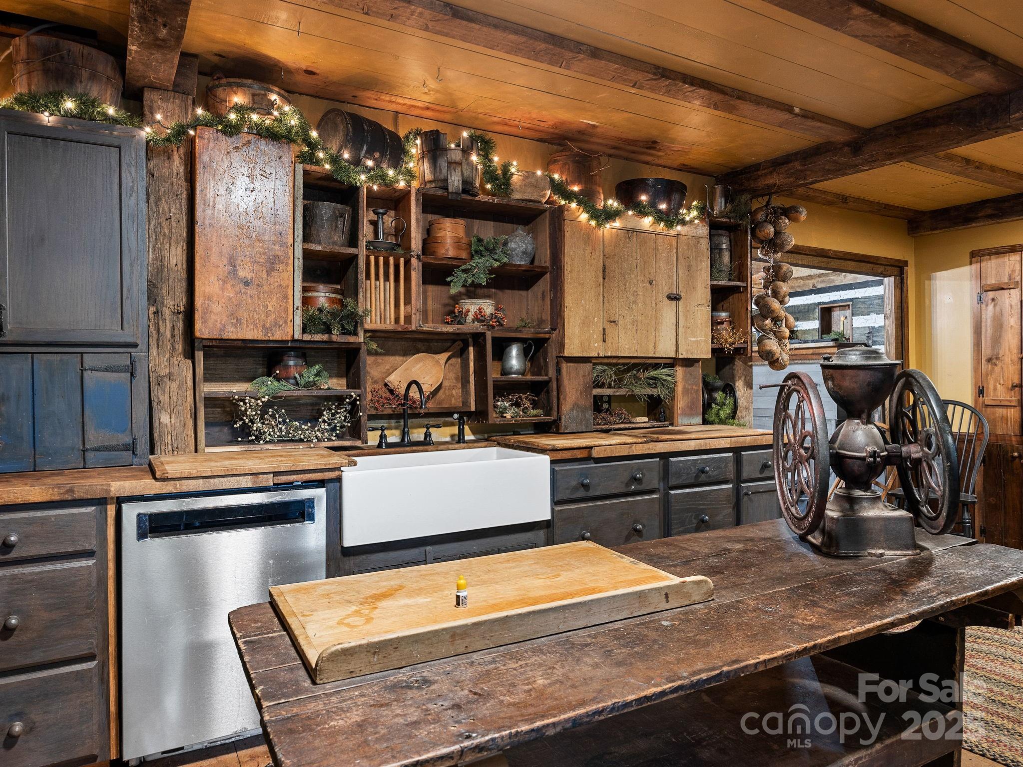 1933 John Shehan Road Mill Spring, NC 28756 - Photo 6 of 25 a kitchen with stainless steel appliances granite countertop a sink and wooden cabinets