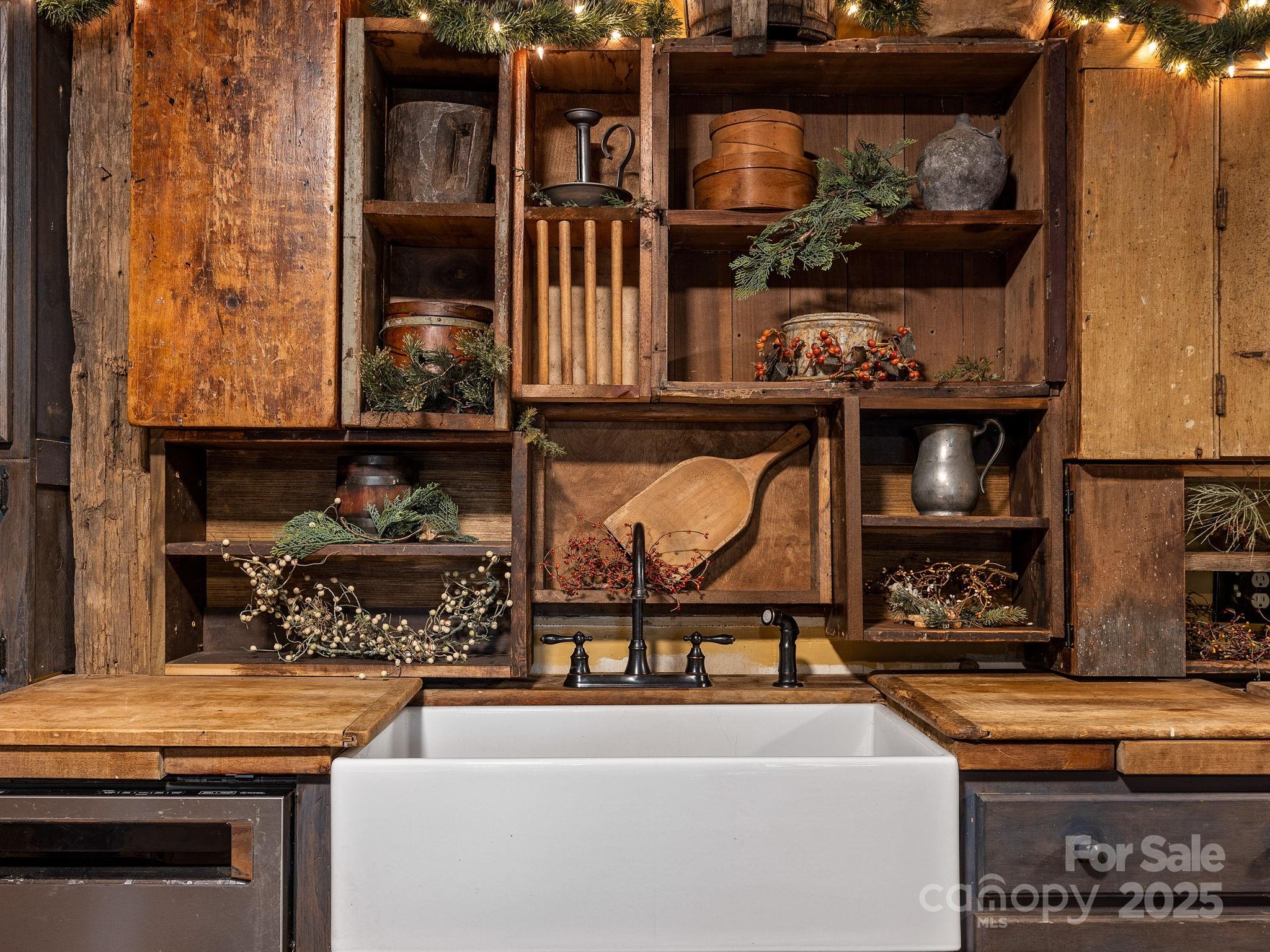 1933 John Shehan Road Mill Spring, NC 28756 - Photo 7 of 25 a table and a stove sitting in a kitchen
