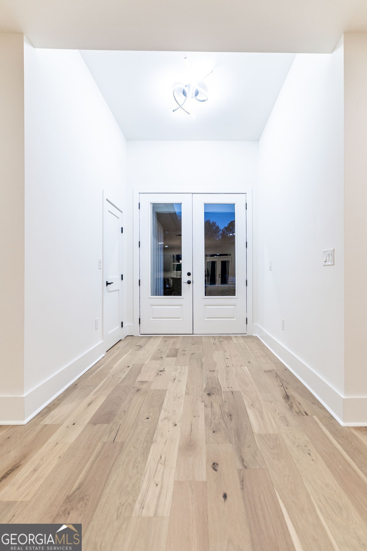 2590 Walton Downs Road, Unit 3 Monroe, GA 30655 - Photo 14 of 37 wooden floor in a empty room