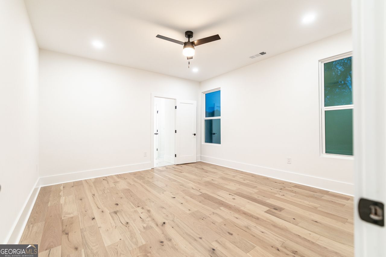 2590 Walton Downs Road, Unit 3 Monroe, GA 30655 - Photo 15 of 37 wooden floor in an empty room