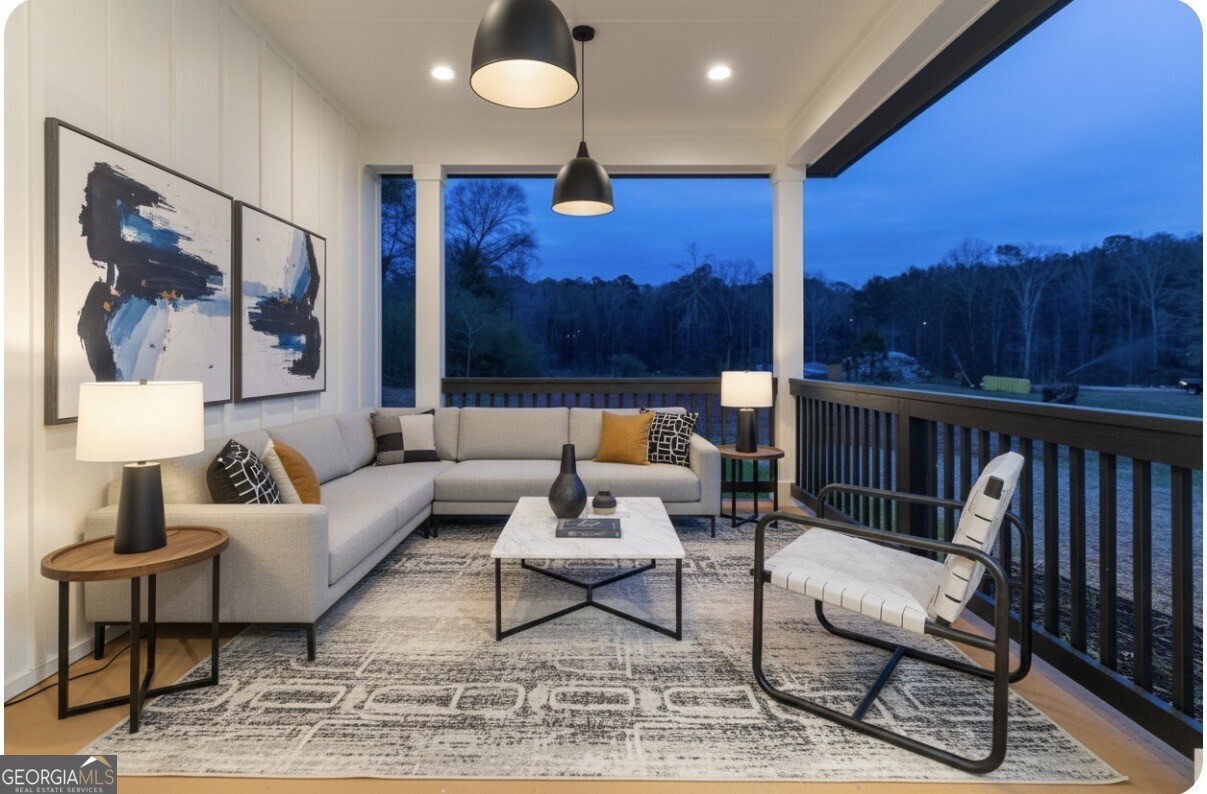 2590 Walton Downs Road, Unit 3 Monroe, GA 30655 - Photo 20 of 37 a living room with furniture and a lamp