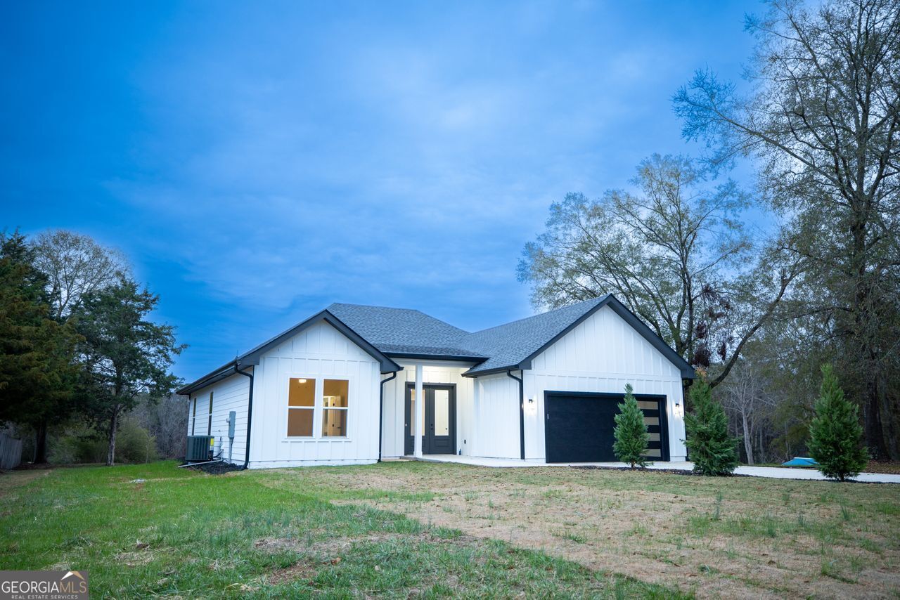 2590 Walton Downs Road, Unit 3 Monroe, GA 30655 - Photo 2 of 37 a front view of house with yard and green space