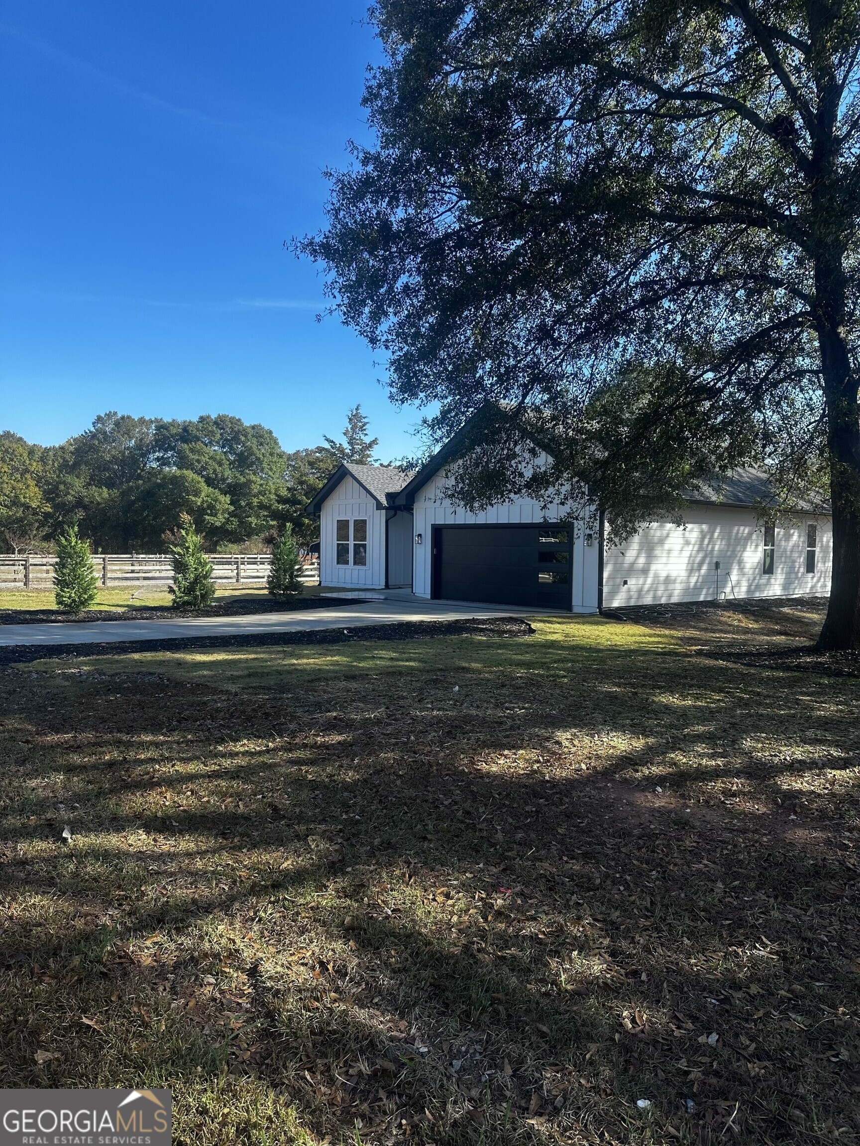 2590 Walton Downs Road, Unit 3 Monroe, GA 30655 - Photo 8 of 37 a view of big yard next to a house