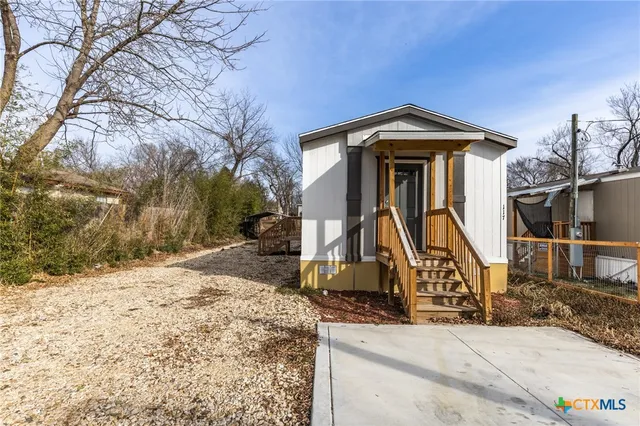 a view of a house with snow on the wall