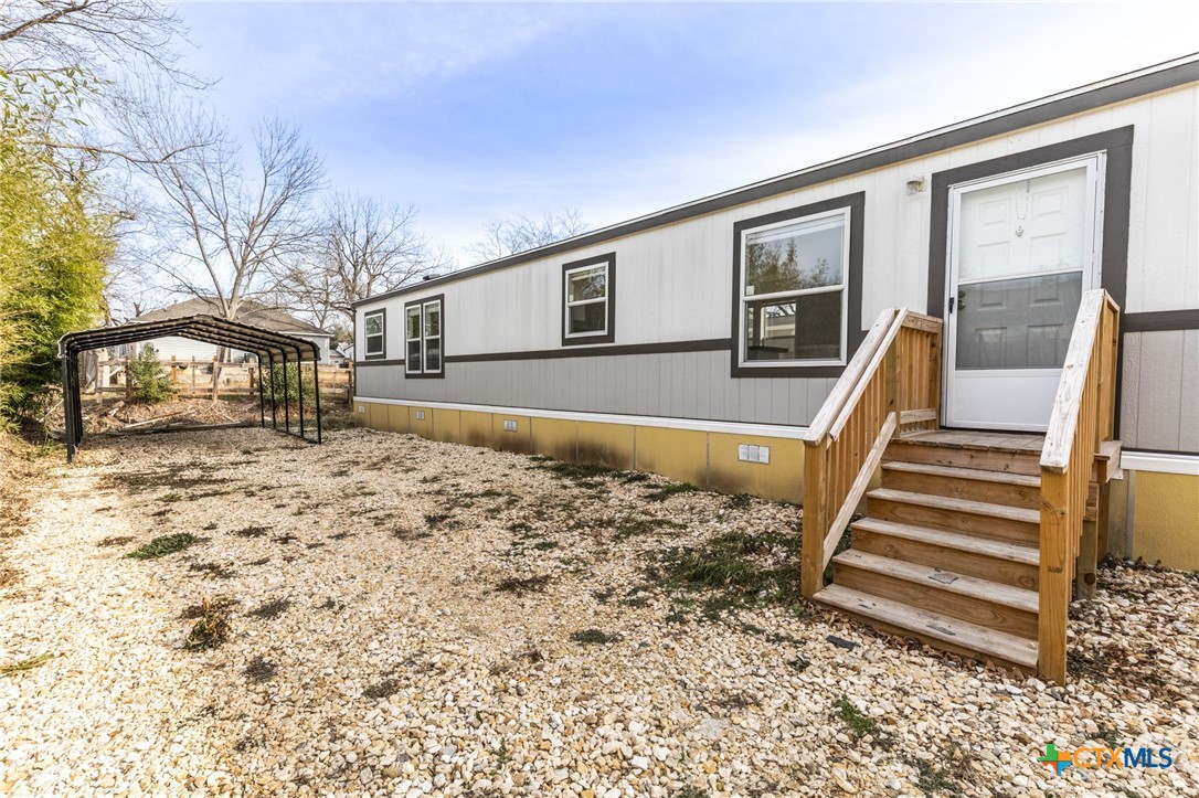 117 Royal Street Taylor, TX 76574 - Photo 5 of 16 a front view of a house with a yard