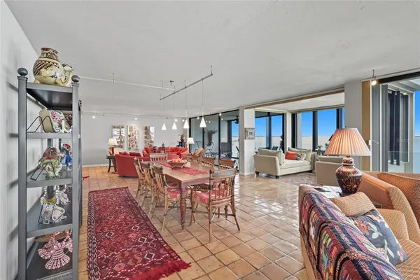 a living room with fireplace furniture and a window