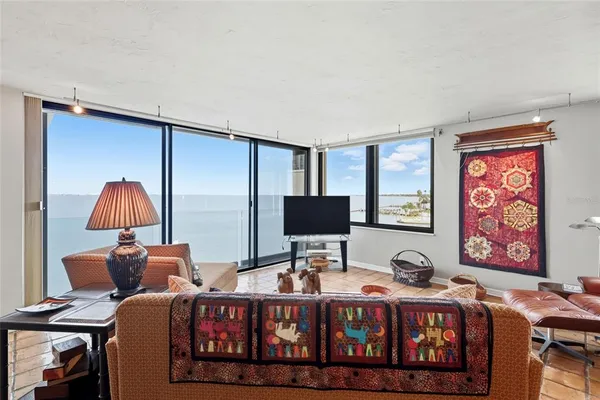 a bedroom with furniture and a flat screen tv
