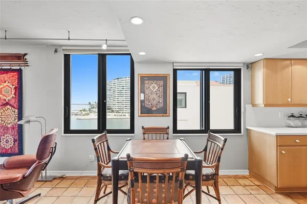 a view of a dining room with furniture and window