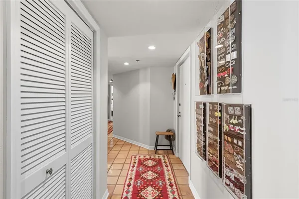 a view of a hallway with paintings on the wall