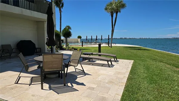 a view of a chairs and table in the patio