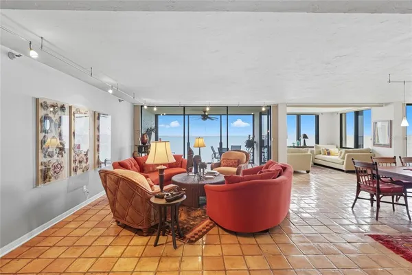 a living room with furniture a window and a table