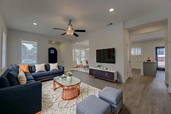 a living room with furniture and a flat screen tv