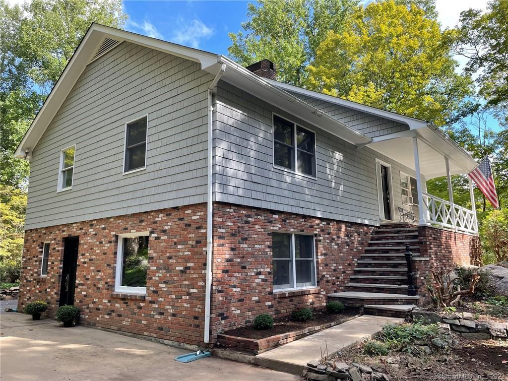 35 Hopewell Woods Road Redding, CT 06896 - Photo 1 of 1 Welcome to 35 Hopewell Woods Rd. Freshly painted cedar shakes and low maintenance brick siding with stairs to the front door.