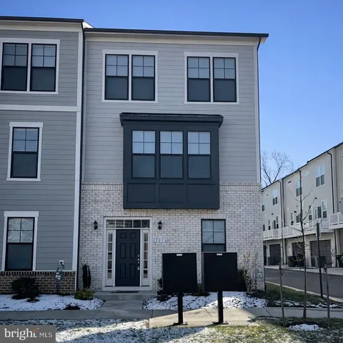 a front view of a house with glass windows