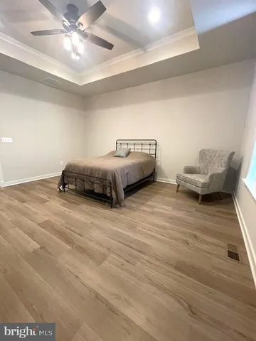 a bathroom with a sink a toilet a mirror and shower