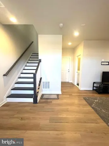 a view of a room with a staircase